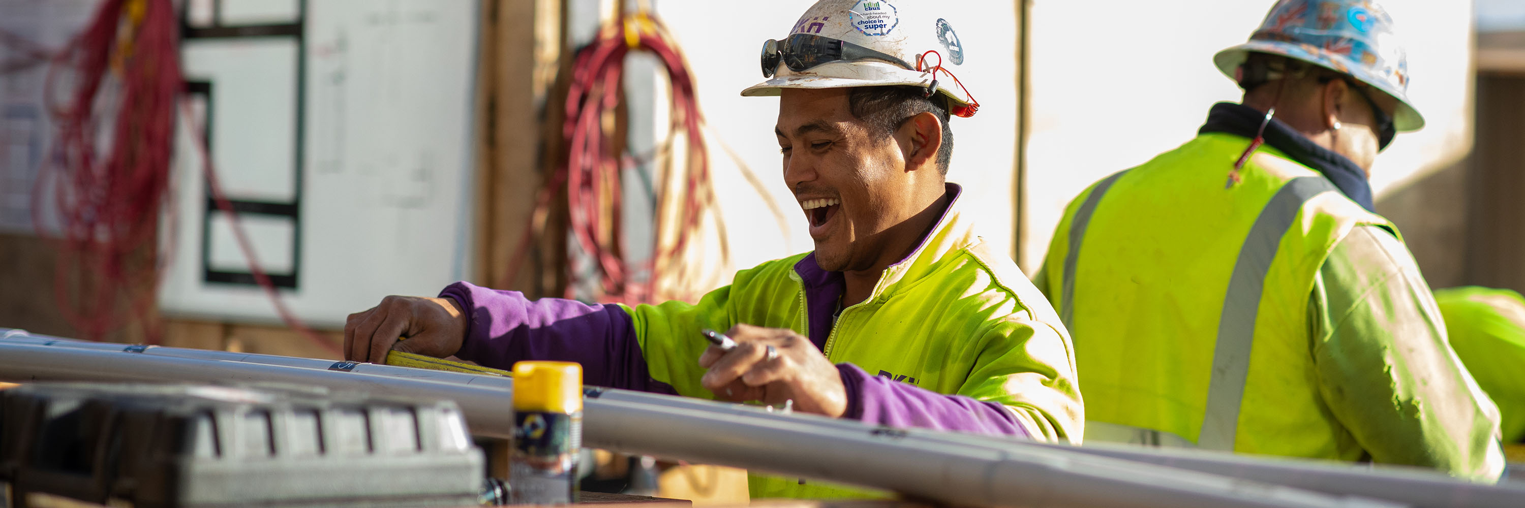 Cbus worker smiling while on job site