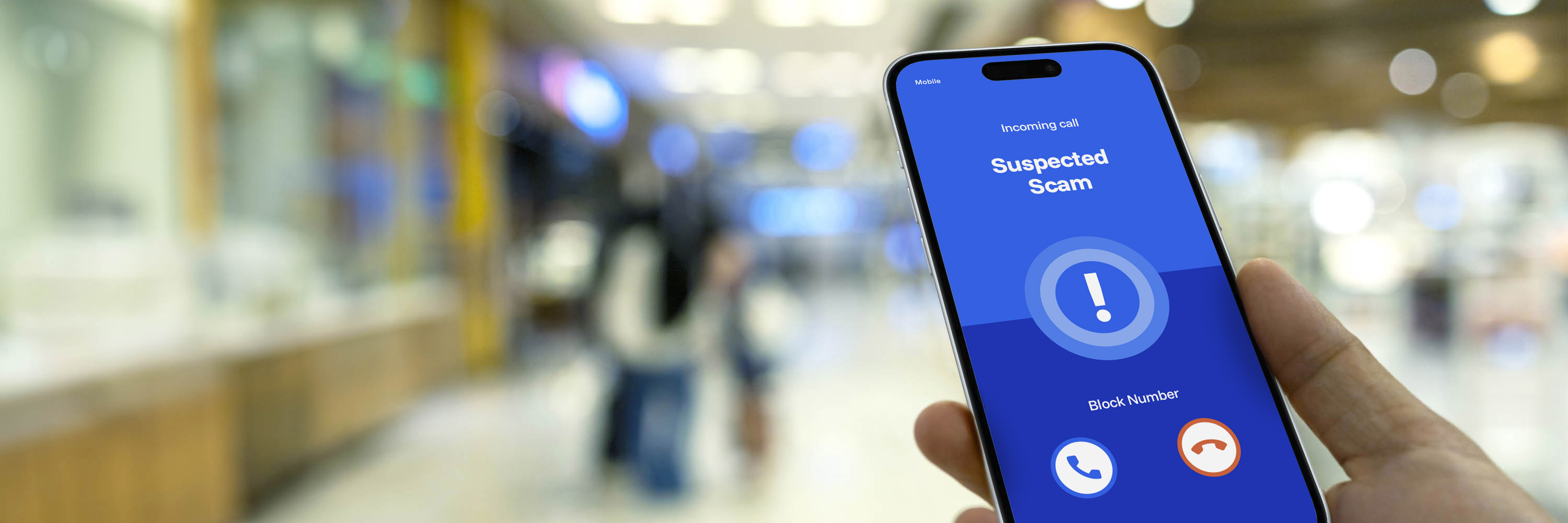 Smartphone screenin a hand showing a warning message