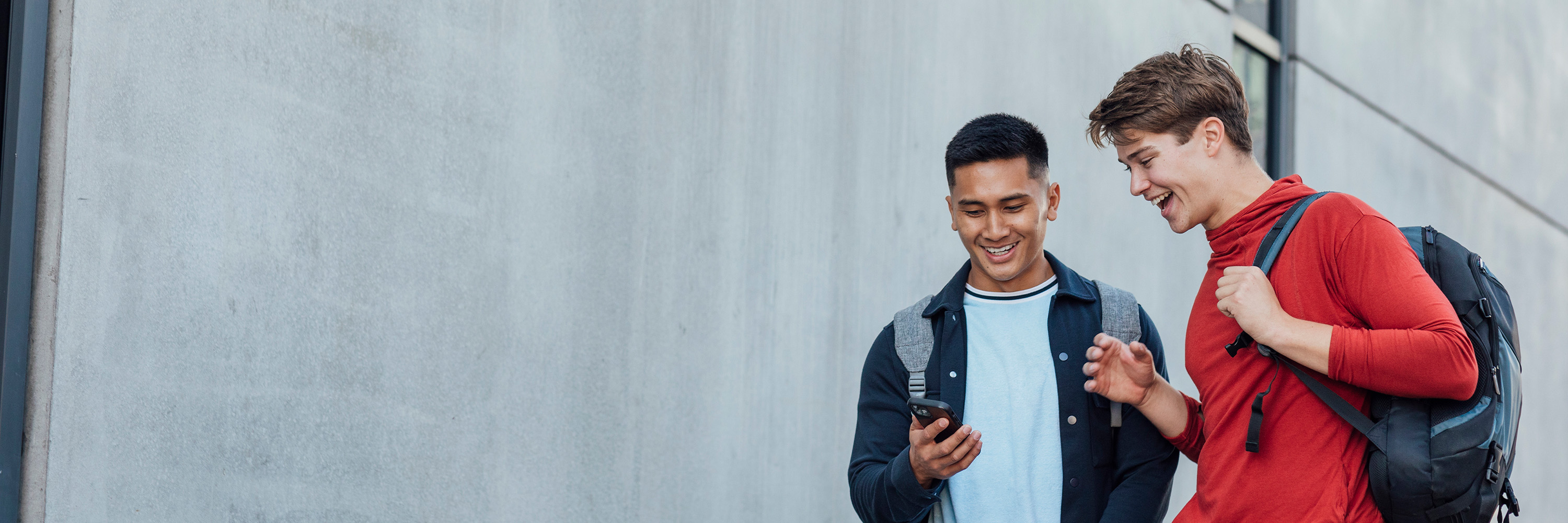 Young men looking at a mobile phone