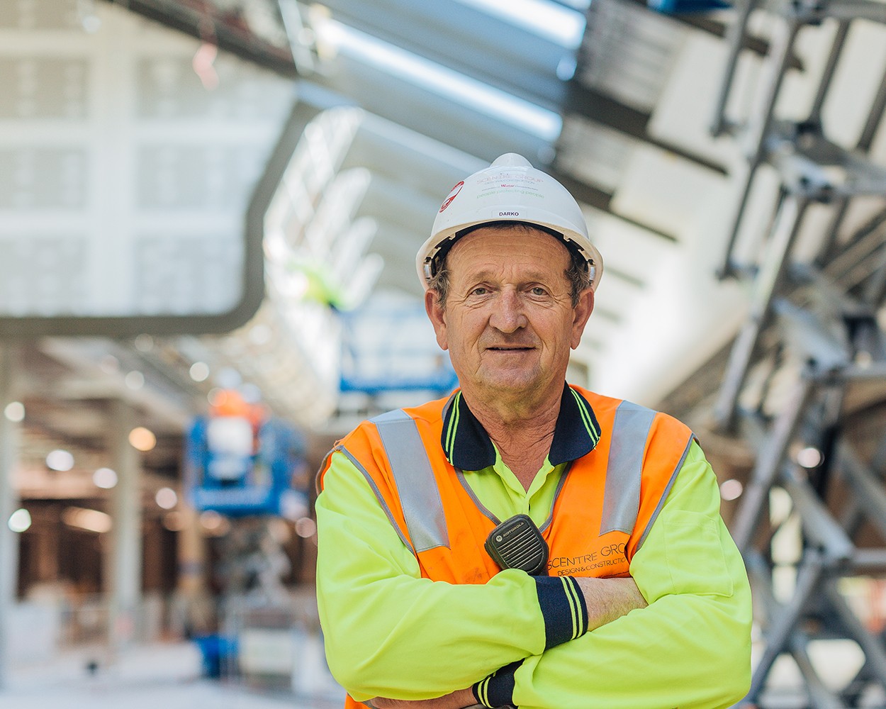 Older tradie looking into the camera