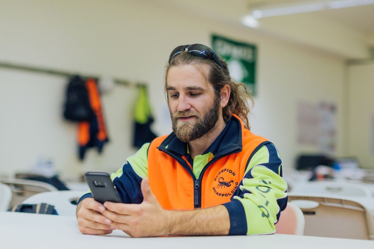 Tradie using phone
