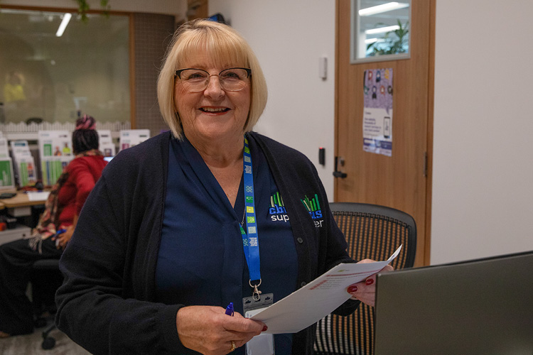 Female customer service staff member standing in an office