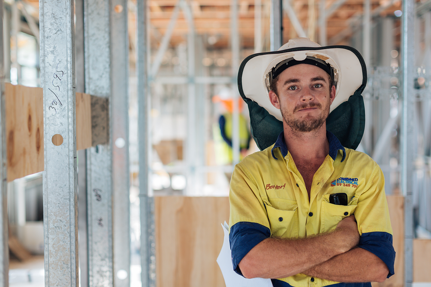 Young male tradie looking at camera