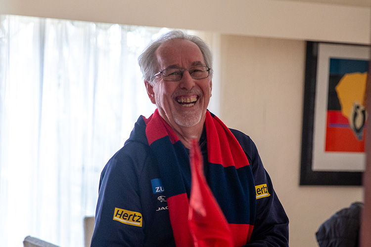 Older man going to a football game