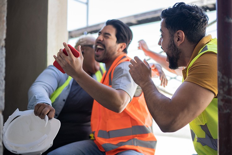Construction workers reinforcing concrete