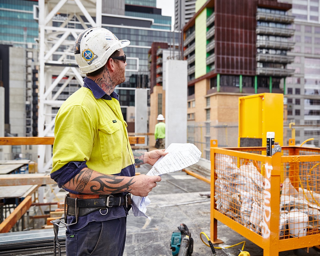 Male construction worker on a rooftop site