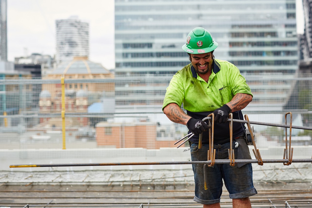 Construction workers reinforcing concrete