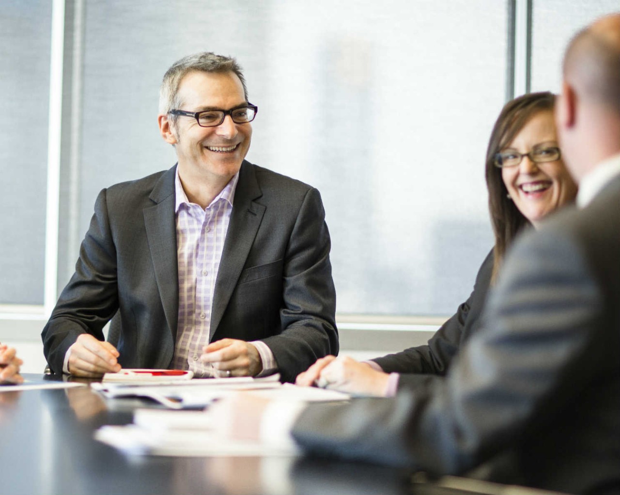 Three office workers in a meeting